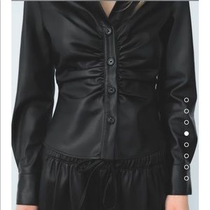 Faux leather form fitting black top